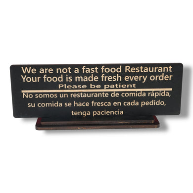 Sign - English & Spanish - With STAND - We are not a fast food restaurant Please Be Patient - 10x4 Inches
