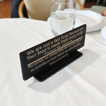 Load image into Gallery viewer, Sign - English &amp; Spanish - With STAND - We are not a fast food restaurant Please Be Patient - 10x4 Inches