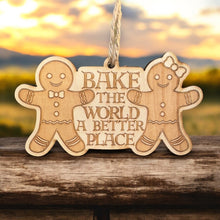 Load image into Gallery viewer, Ornament - Bake the World a Better Place - Raw Wood 4x2in