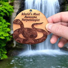 Load image into Gallery viewer, Worlds Most Awesome Herpetologist Snake - Cedar Ornament