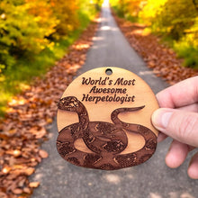 Load image into Gallery viewer, Worlds Most Awesome Herpetologist Snake - Cedar Ornament