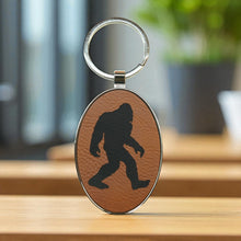 Load image into Gallery viewer, Keychain - Oval/Metal - Bigfoot Sasquatch - Leather