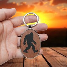 Load image into Gallery viewer, Keychain - Oval/Metal - Bigfoot Sasquatch - Leather