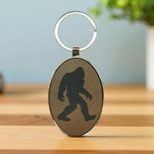 Load image into Gallery viewer, Keychain - Oval/Metal - Bigfoot Sasquatch - Leather