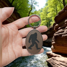 Load image into Gallery viewer, Keychain - Oval/Metal - Bigfoot Sasquatch - Leather
