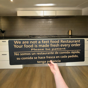 Sign - Black - English & Spanish We are not a fast food restaurant LARGE 10x32