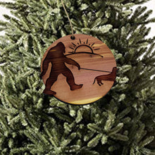 Load image into Gallery viewer, Sasquatch walking his dog - Cedar Ornament