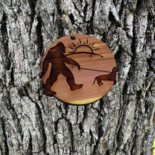 Load image into Gallery viewer, Sasquatch walking his dog - Cedar Ornament