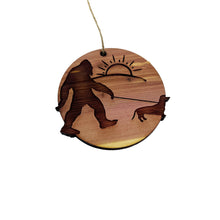 Load image into Gallery viewer, Sasquatch walking his dog - Cedar Ornament